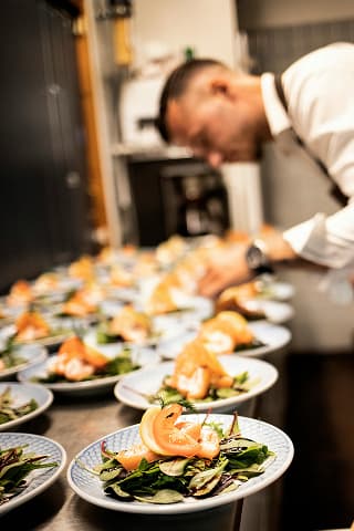 Chef plating on table